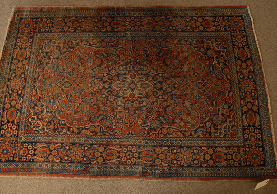 Appraisal: An Antique Kirman Rug worn pile edges and fringe '