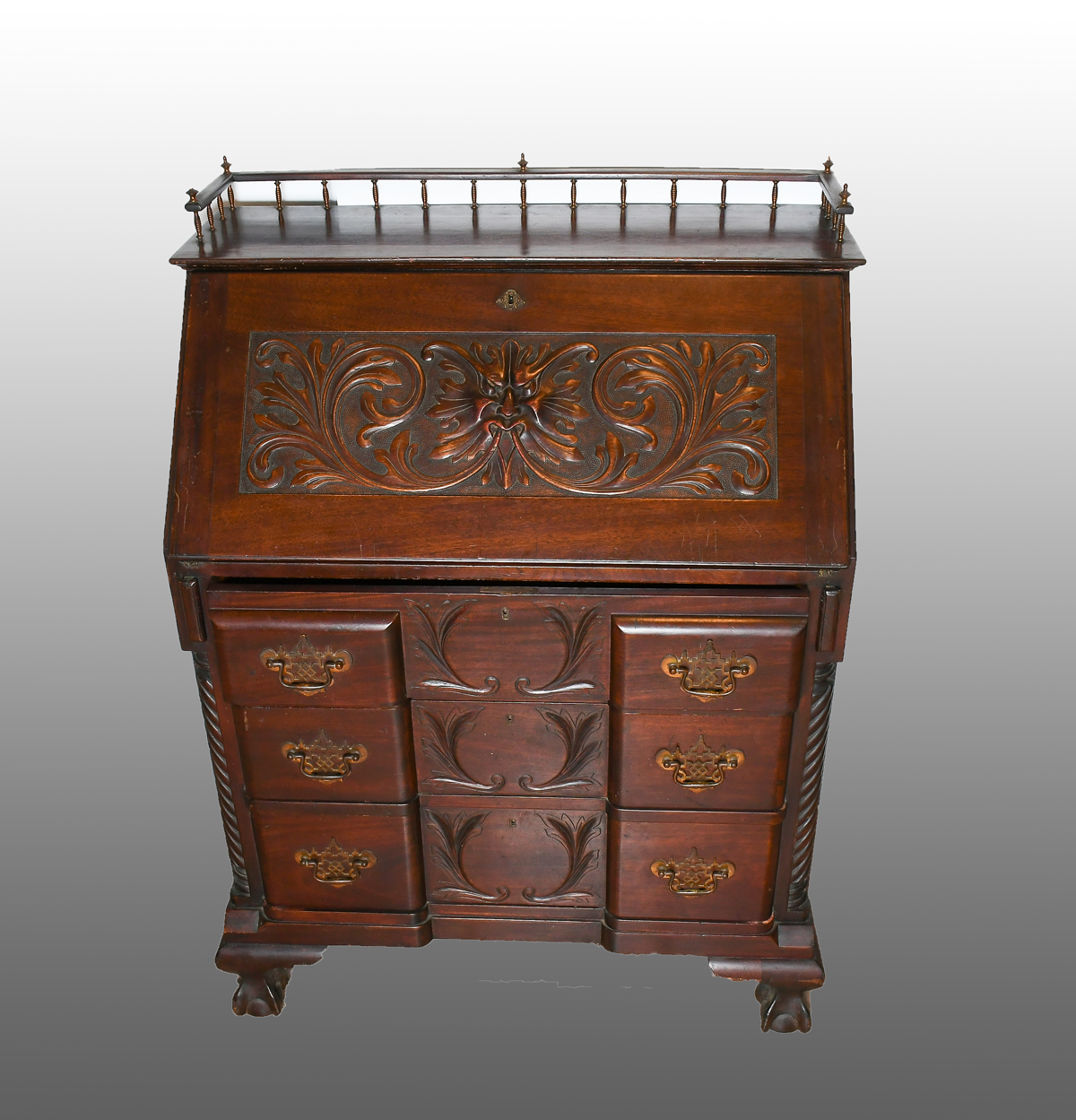 Appraisal: GREENMAN MOTIF SLANT FRONT DESK Gallery top slant front desk