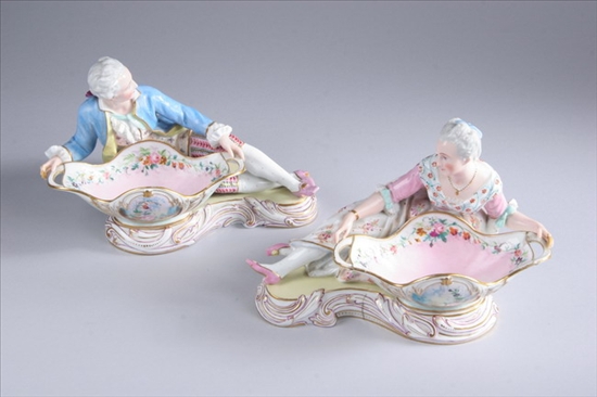 Appraisal: PAIR GERMAN PORCELAIN FIGURAL SWEETMEAT DISHES late th-early th century