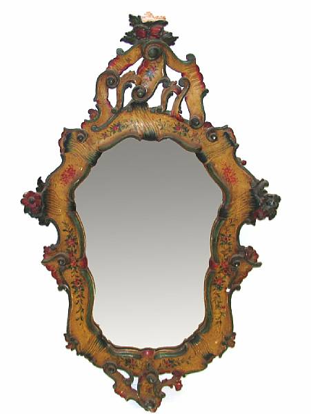 Appraisal: An Italian carved and polychrome decorated wall mirror height in