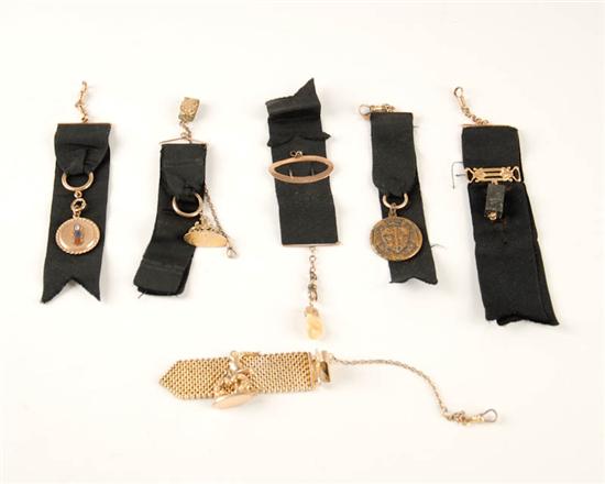 Appraisal: A Lot of Black Silk Ribbon Watch Fobs one holding