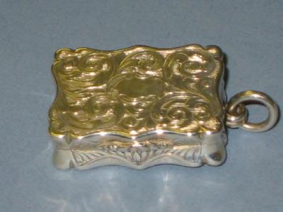 Appraisal: A VICTORIAN VINAIGRETTE of shaped oblong form the whole chased