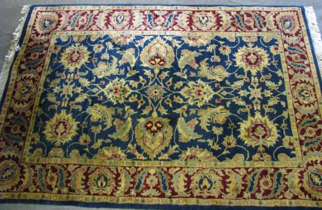 Appraisal: x ' Oriental rug traditional floral pattern medium blue field