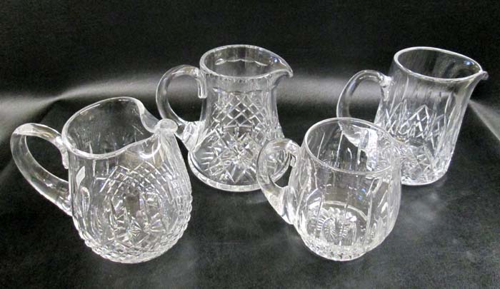 Appraisal: FOUR CRYSTAL BEVERAGE PITCHERS by Webb Stuart and others having