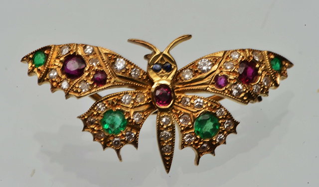 Appraisal: A RUBY EMERALD AND DIAMOND SET BUTTERFLY BROOCH PENDANT with