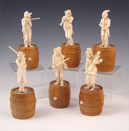 Appraisal: GERMAN CARVED IVORY BAND MUSICIANS Finely and intricately carved musicians