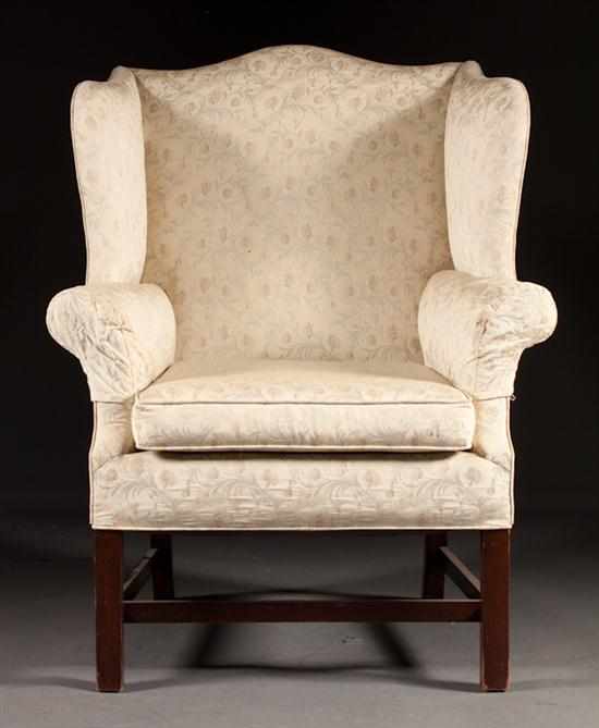 Appraisal: Chippendale style mahogany upholstered wing chair th century in H