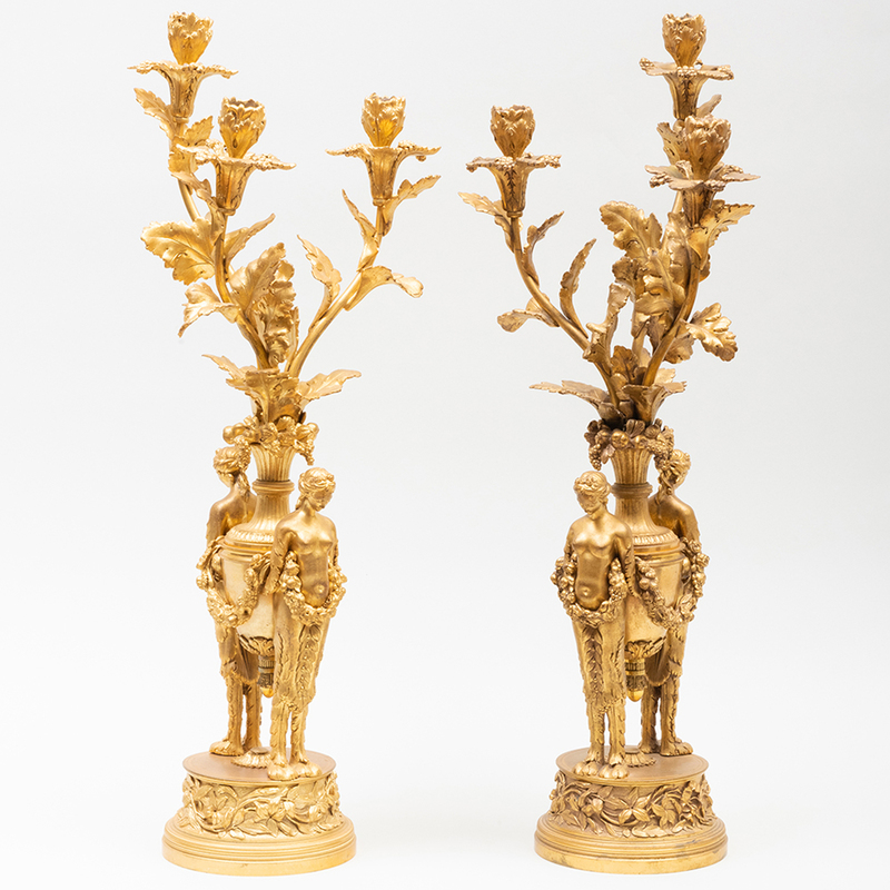 Appraisal: PAIR OF LOUIS XVI STYLE GILT-BRONZE THREE-LIGHT FIGURAL CANDELABRA x