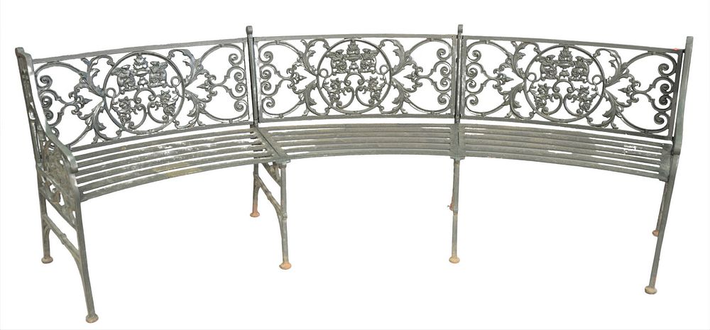 Appraisal: Iron Curved Bench with winged griffin back and slat style