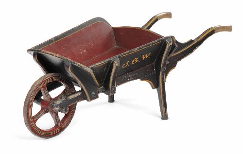 Appraisal: A small th century painted wood wheelbarrow of typical form