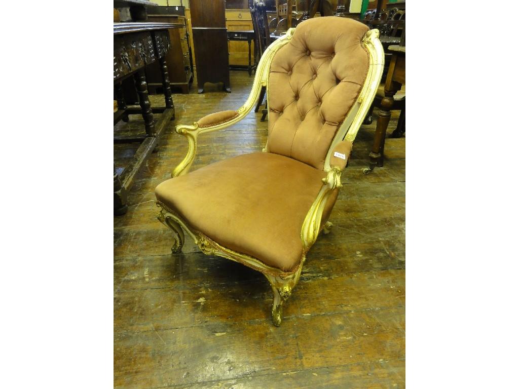 Appraisal: A Victorian spoonback armchair with serpentine upholstered seat and button