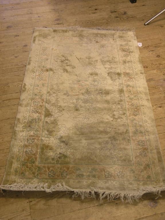 Appraisal: A Chinese silk rug floral pattern against a celadon ground