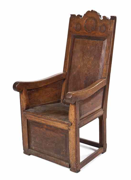 Appraisal: A Jacobean Revival Armchair the carved crest over the plank