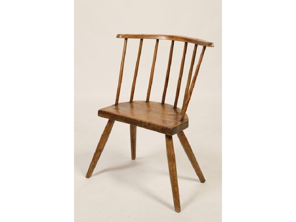 Appraisal: A PRIMITIVE WINDSOR STICK BACK SIDE CHAIR the shaped armrest