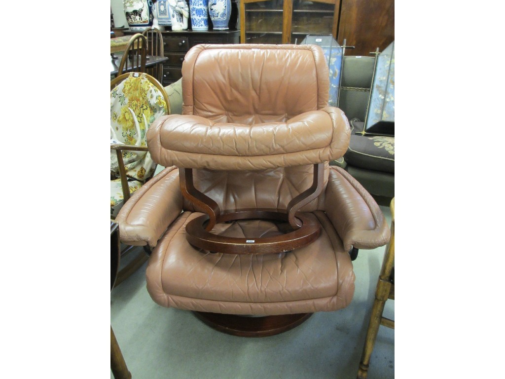 Appraisal: Leather reclining armchair with matching footstool