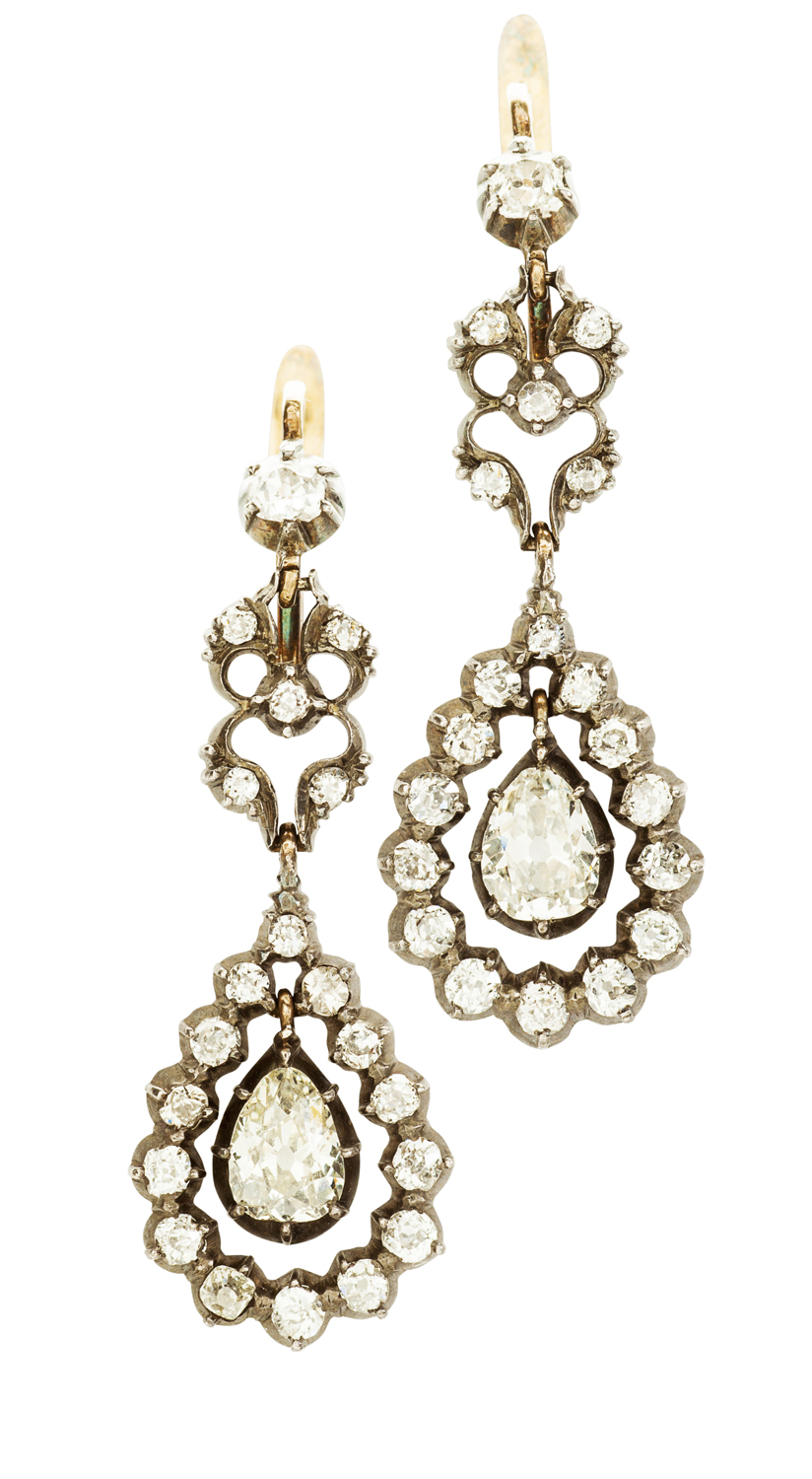 Appraisal: A pair of Edwardian diamond cluster earrings each of open