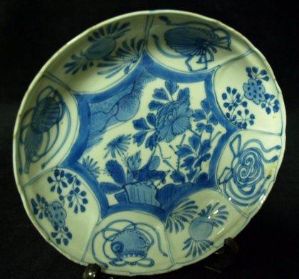 Appraisal: A circular Ming saucer shaped dish with central garden scene