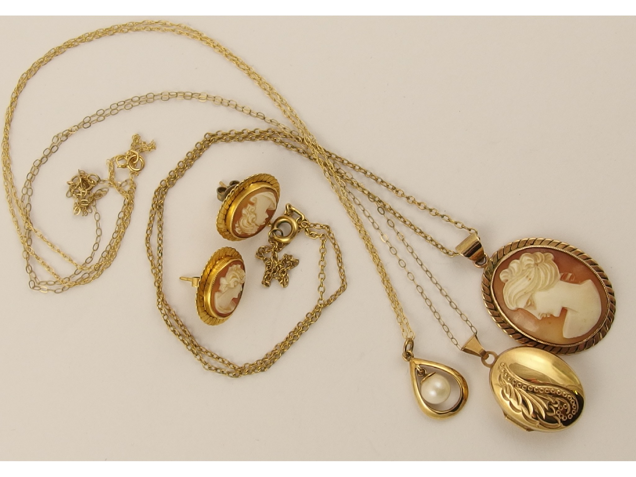 Appraisal: A ct cameo pendant and earrings ct locket and a