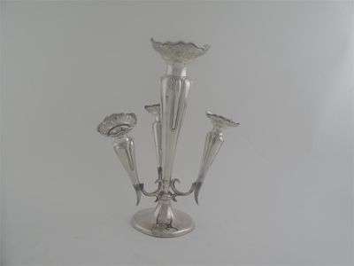 Appraisal: An Edwardian epergne with four detachable tapering vases each with