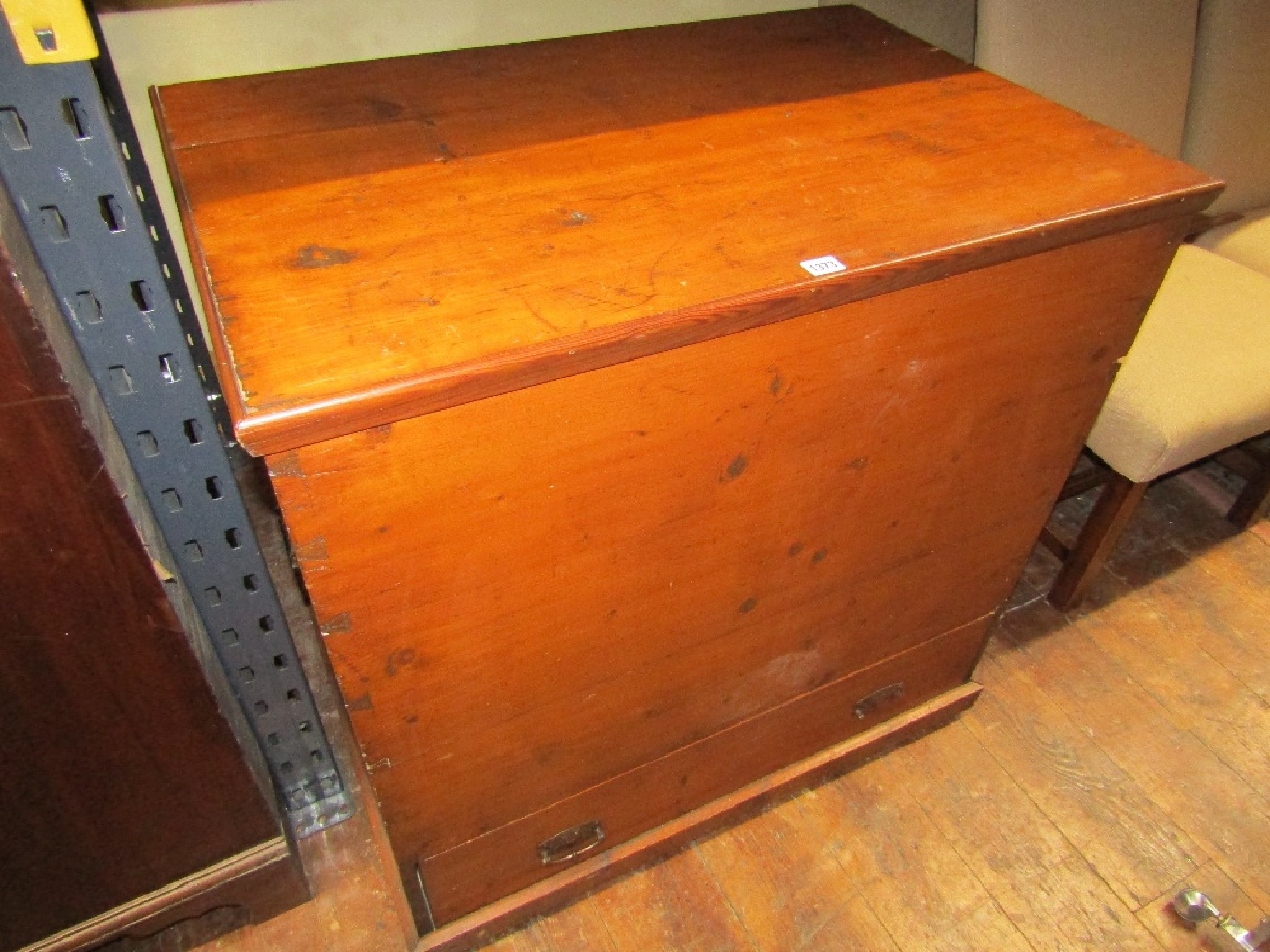 Appraisal: A th century pine blanket chest with rising lid over