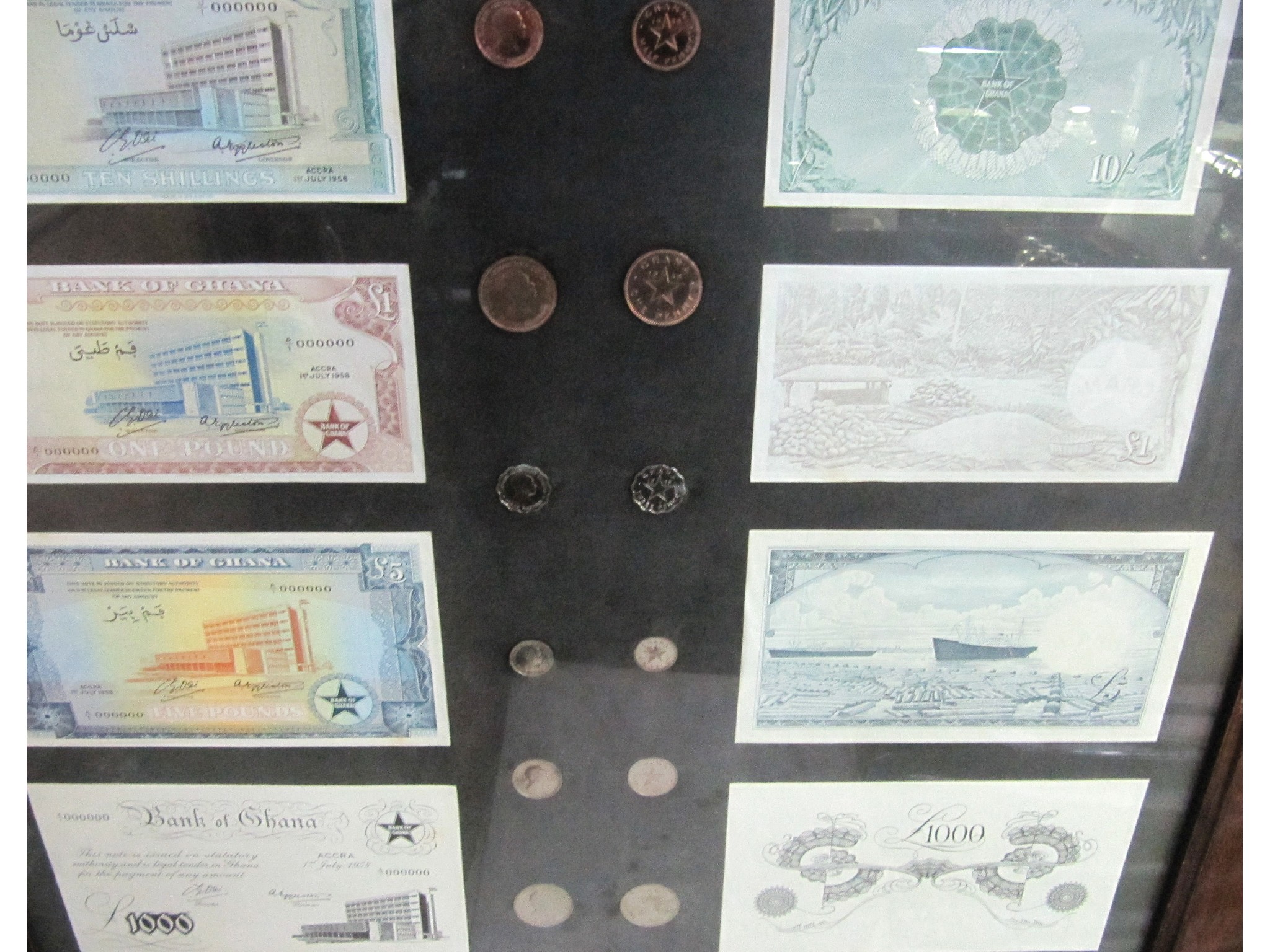 Appraisal: A framed and mounted set of uncirculated Ghanaian banknotes and