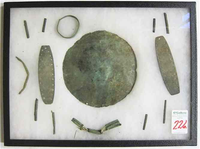 Appraisal: THIRTEEN NATIVE AMERICAN INDIAN COPPER PIECES including convex-shaped breast plate