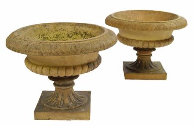 Appraisal: A pair of terracotta garden urns each with a stiff