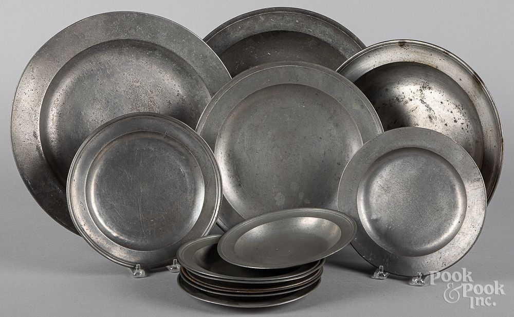 Appraisal: English pewter chargers deep dishes and plates English pewter chargers