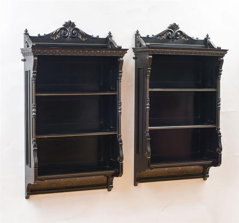 Appraisal: RENAISSANCE REVIVAL PAIR OF HANGING SHELVES Ebonized finish gilt-incised decoration