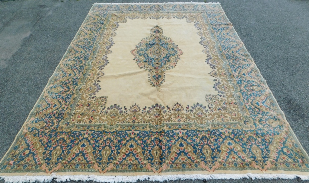 Appraisal: LG TAN BOTANICAL RUG Middle East th CenturyBlue pink golden