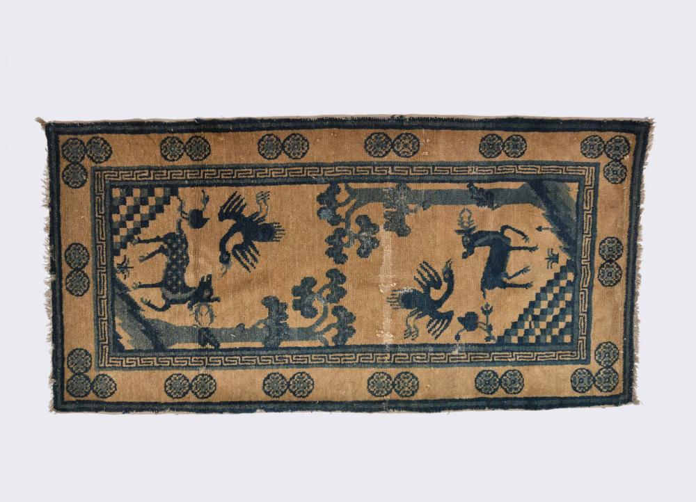 Appraisal: CHINESE WOOL RUGDecorated in blue with animals in a wooded