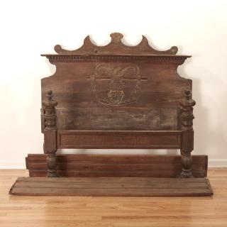 Appraisal: Italian Baroque carved walnut bed Italian Baroque carved walnut bed