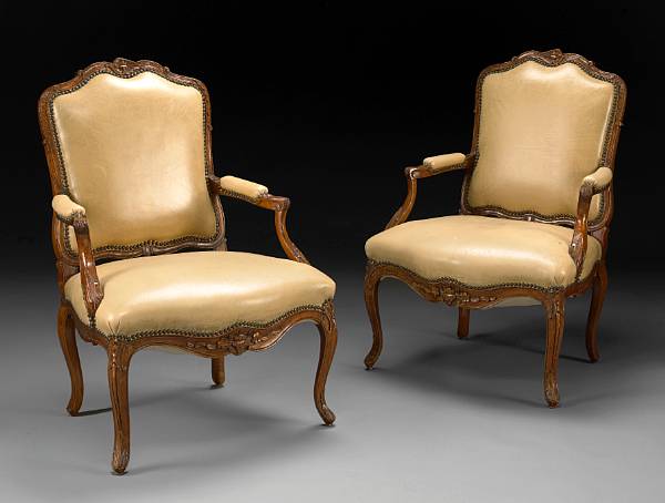 Appraisal: A pair of Louis XV style walnut fauteuils late th