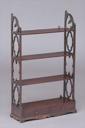 Appraisal: GEORGE III MAHOGANY HANGING SHELF Incorporating shelves flanked by open