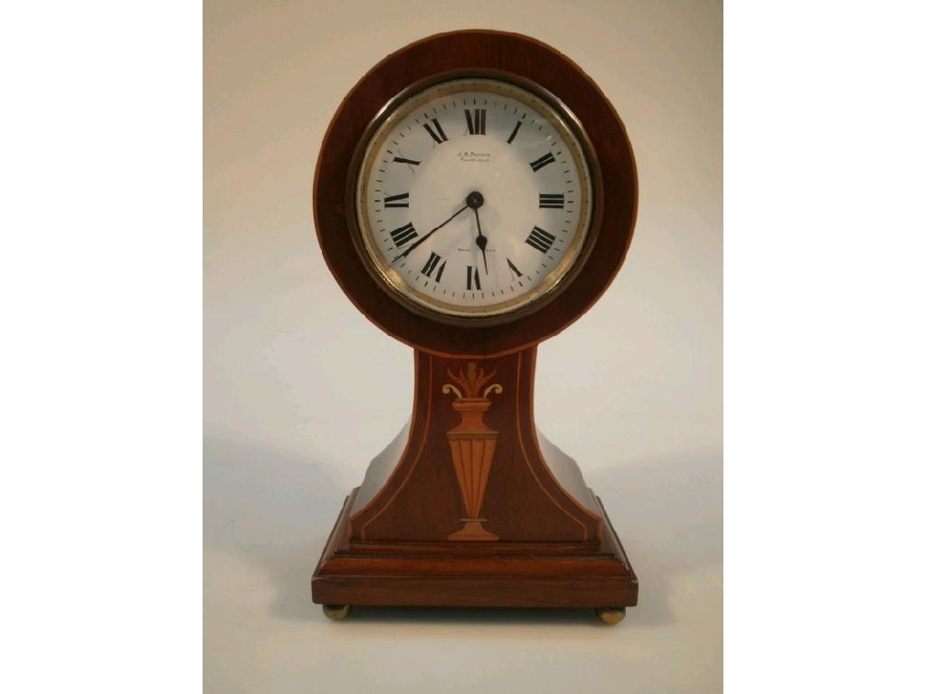 Appraisal: An Edwardian mantel clock in an inlaid mahogany drumhead case