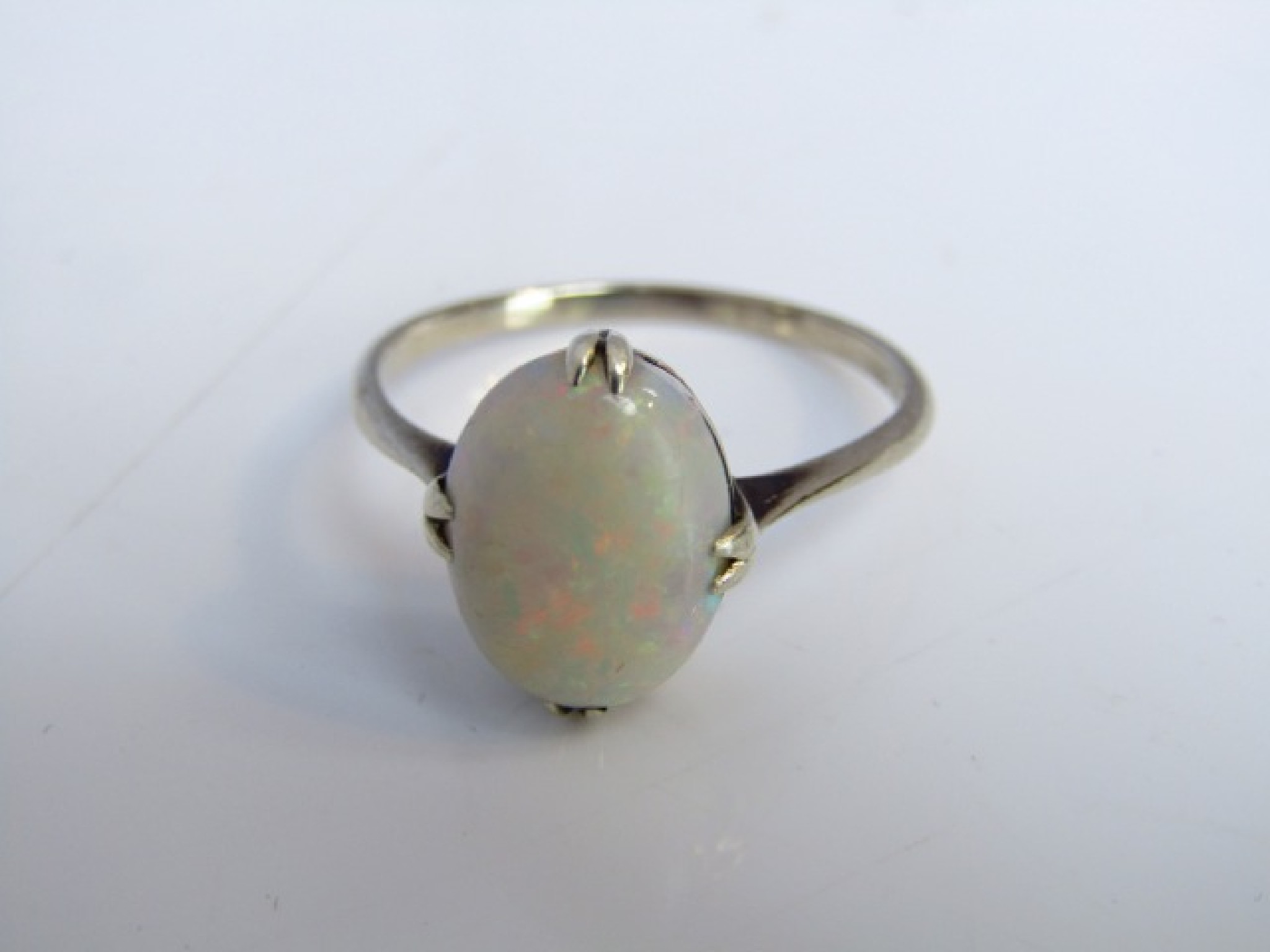 Appraisal: A gem-set ring probably opal mounted in white metal size