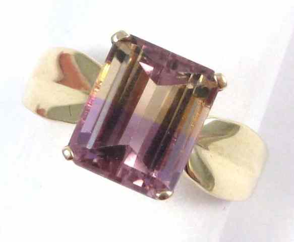 Appraisal: AMETRINE AND FOURTEEN KARAT GOLD SOLITAIRE RING set with an