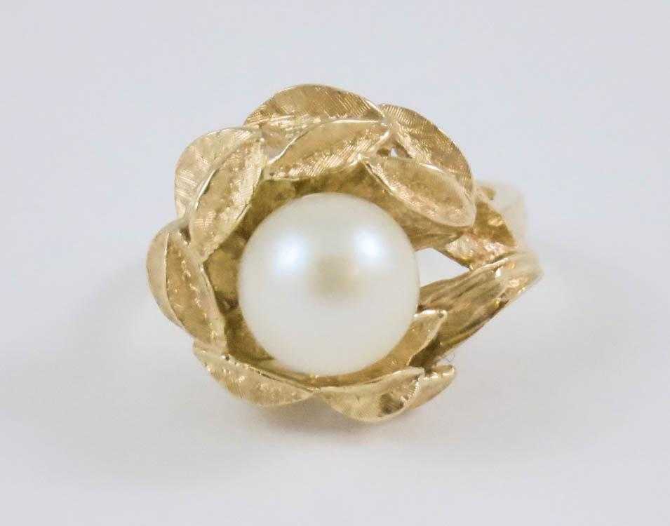 Appraisal: PEARL AND FOURTEEN KARAT GOLD RING set with an mm