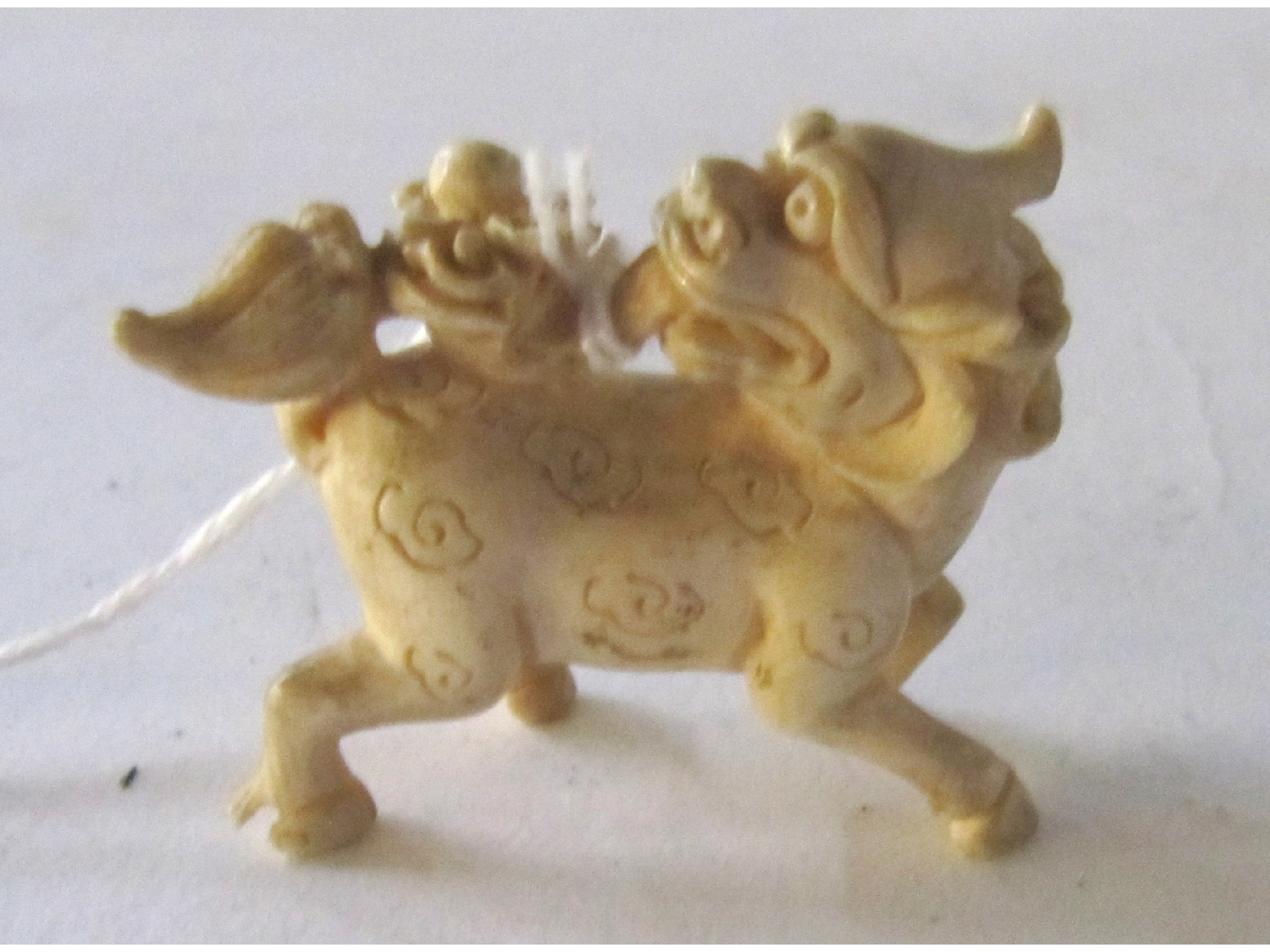 Appraisal: A netsuke - temple lion