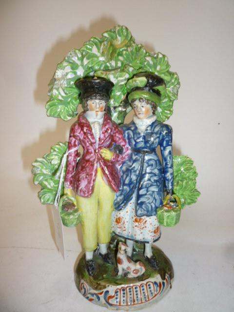 Appraisal: A PEARLWARE FIGURE GROUP early th century Dandies modelled as