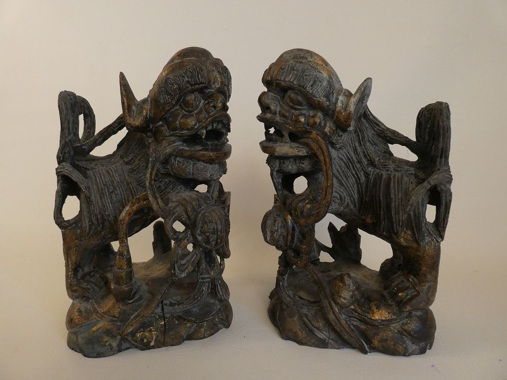 Appraisal: ASIAN WOOD FOO DOGS Pair of carved and parcel gilt