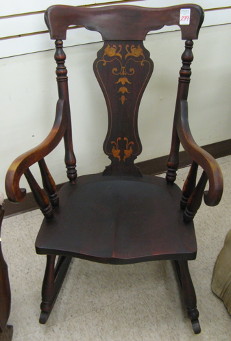 Appraisal: AN INLAID MAHOGANY ROCKING ARMCHAIR American c having a serpentine-shaped