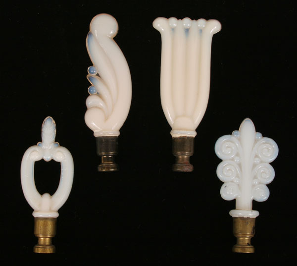 Appraisal: Four opaque Aladdin lamp finials various floriform designs with brass