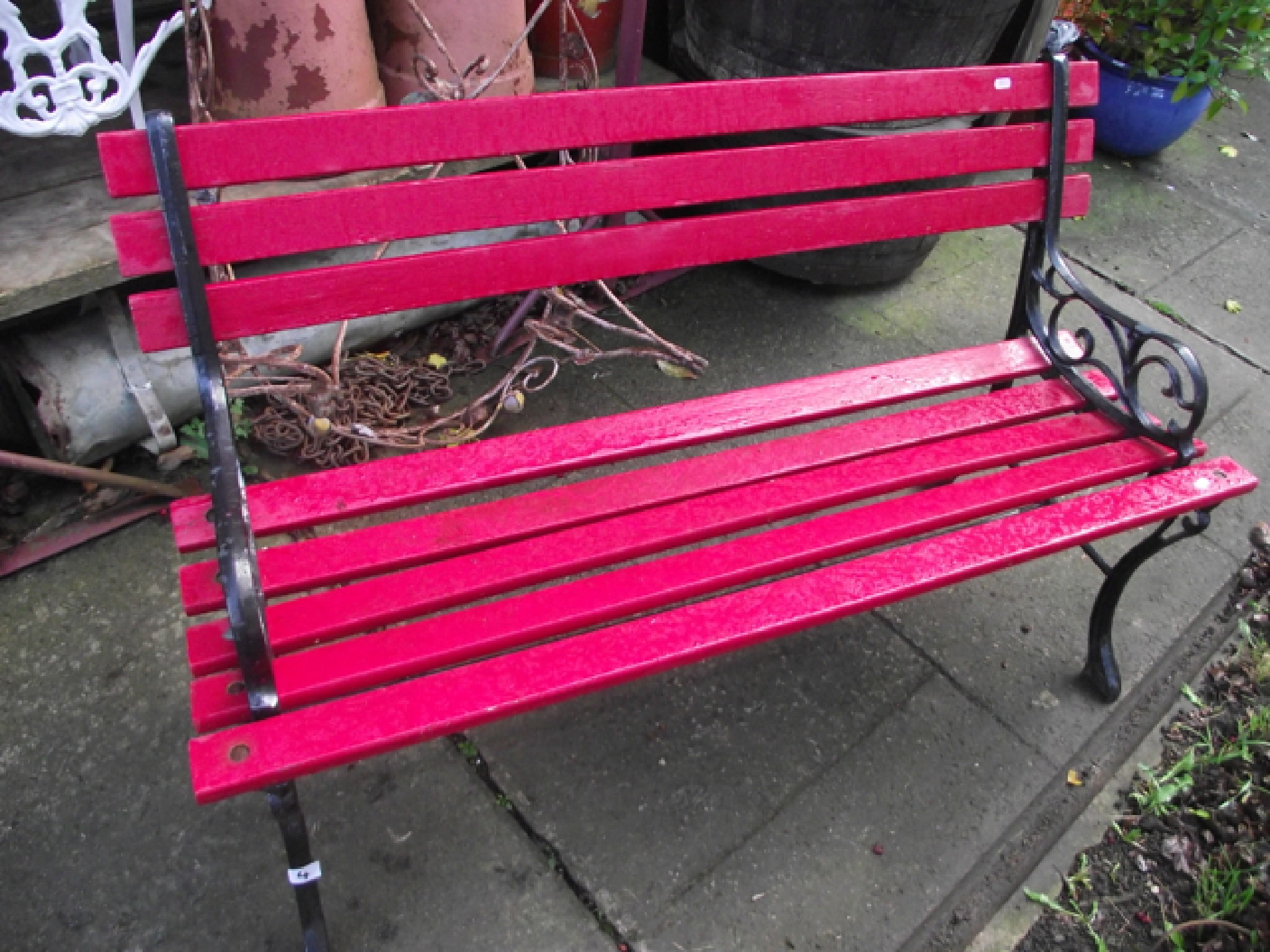 Appraisal: A small two seat garden bench with painted wooden slatted