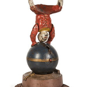 Appraisal: A Spinning Clown on Globe Cast Iron Mechanical Bank Late