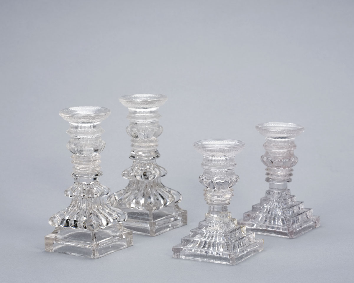 Appraisal: PAIR OF LACY PRESSED COLORLESS GLASS CANDLESTICKS CIRCA - Each