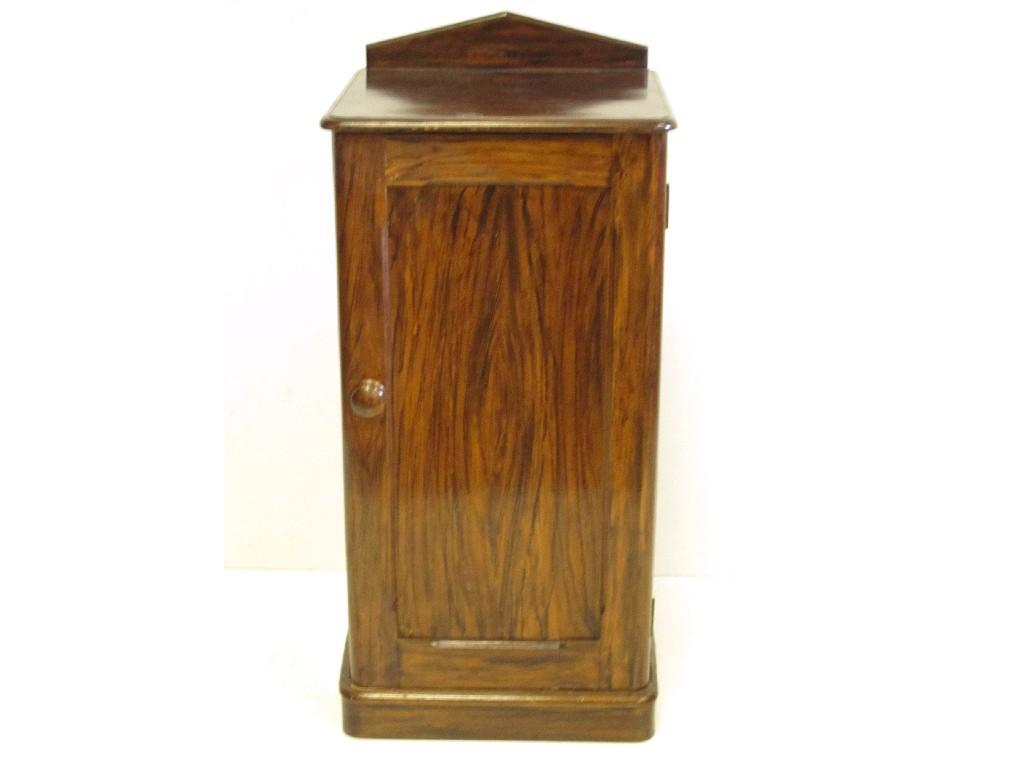 Appraisal: A Victorian stained pine Pot Cupboard with single solid panelled