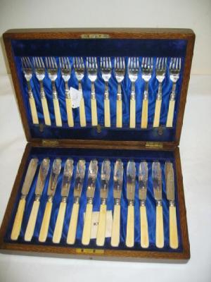 Appraisal: A SET OF FISH EATERS for twelve settings with ivory