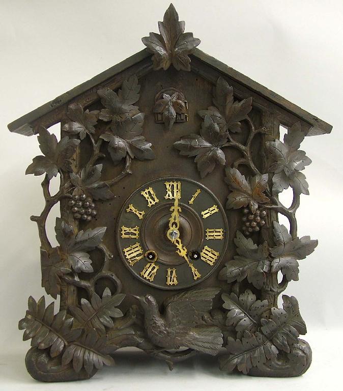 Appraisal: German Black Forest cuckoo mantel clock the dial within a