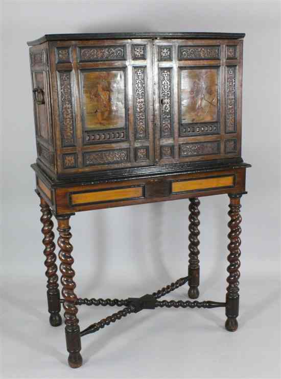 Appraisal: A Dutch th century design carved and inlaid walnut cabinet